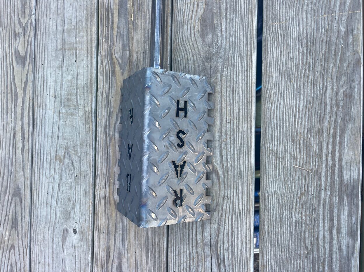 Rash Bar diamond plate surface with RASH branding