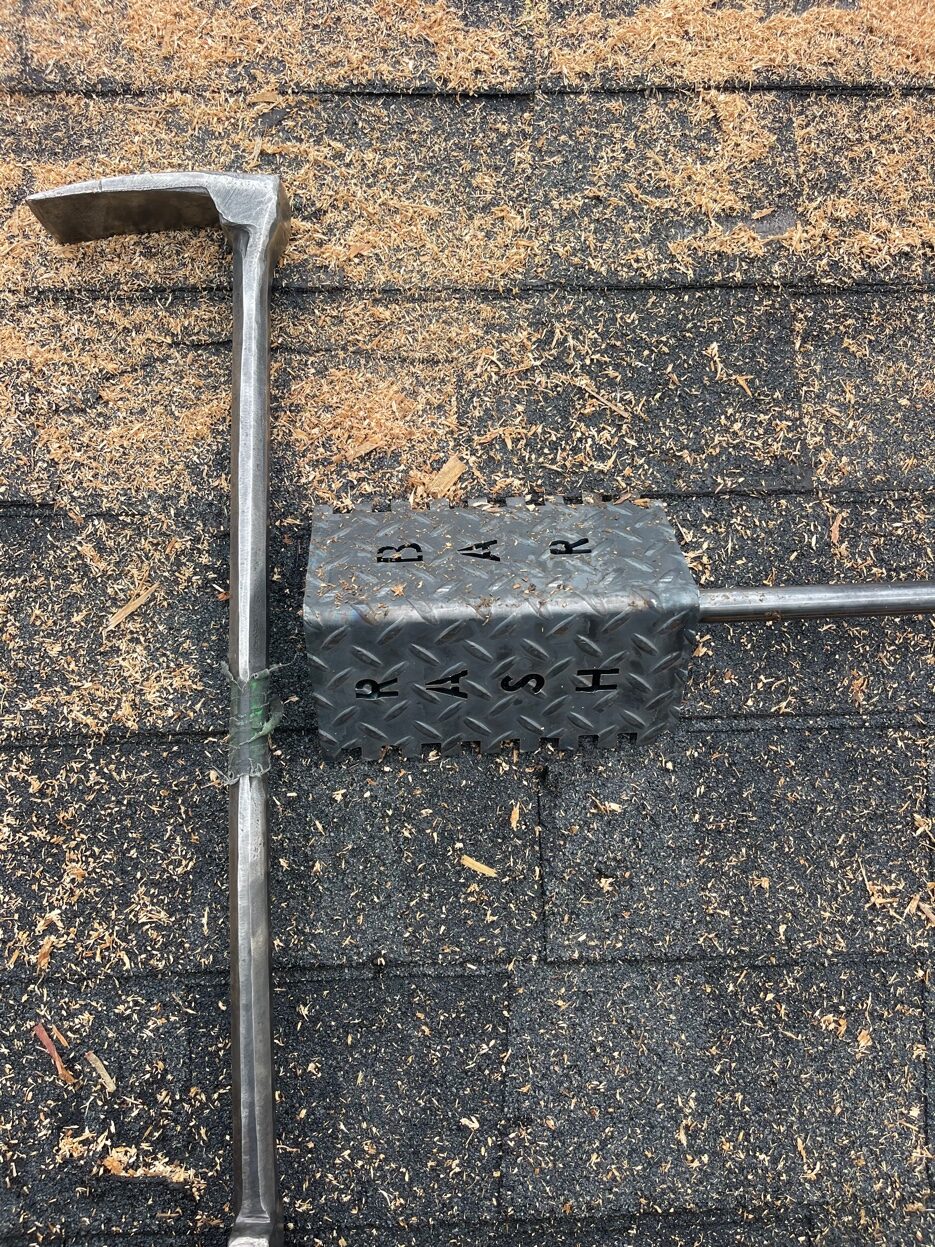 Rash Bar alongside halligan showing size comparison